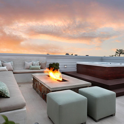 Example of a trendy deck design in Orange County with a fire pit