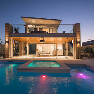 Large beach style courtyard deck photo in Other with a roof extension