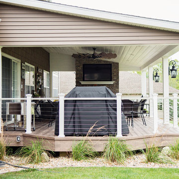 Beautiful #ExteriorMakeOver with large covered deck & fireplace