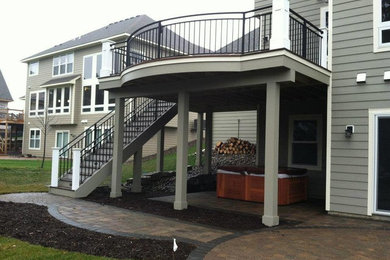 Example of a large arts and crafts deck design in Minneapolis