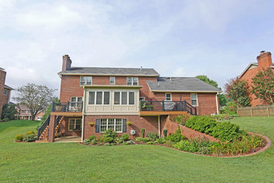 Large elegant backyard deck photo in Other with no cover