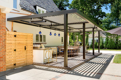 Inspiration for a large transitional backyard outdoor kitchen deck remodel in Columbus with a pergola