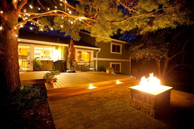 Deck - large deck idea in Denver with a fire pit
