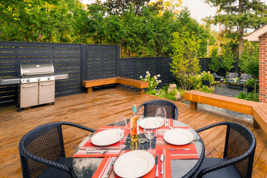 Deck - mid-sized eclectic backyard deck idea in Toronto