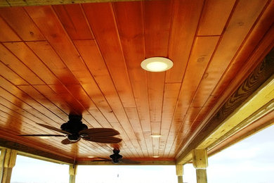Deck - large tropical backyard deck idea in Orlando