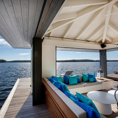 Inspiration for a mid-sized coastal backyard dock remodel in Toronto with a roof extension