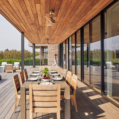 Deck - huge coastal deck idea in New York with a roof extension