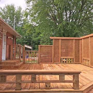 Brown Treated Wood Deck with Custom Privacy Wall and Custom Bench