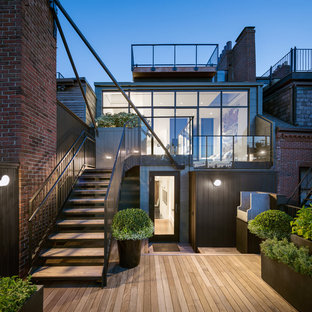 Ispirazione per una grande terrazza moderna dietro casa con nessuna copertura