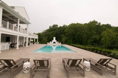 Deck - large traditional backyard deck idea in DC Metro with a roof extension