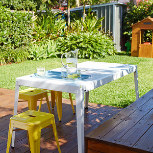 Mid-sized contemporary backyard deck in Sydney.