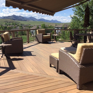 Capped composite deck with synthetic woven outdoor furniture