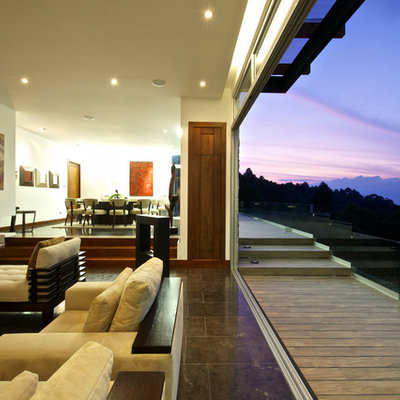 Example of a trendy deck design in Other with an awning