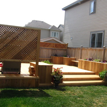 cedar backyard deck with benches and flower boxes