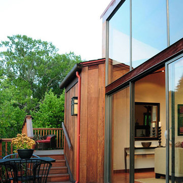 Cedar siding, ipe deck & aluminum windows.