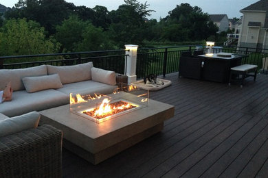 Large back terrace in Minneapolis with a fire feature and no cover.