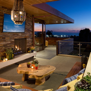 Deck - asian deck idea in San Diego with a fire pit and a roof extension