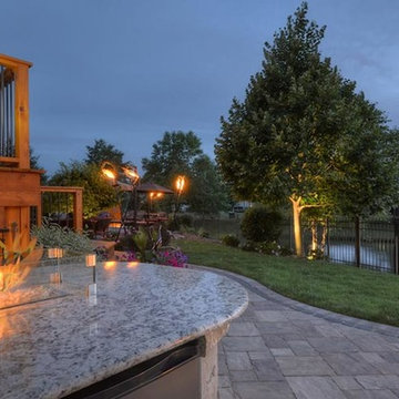 Cobblestone Landscape Renovation with Paver Pool Deck, Pergola, Outdoor Kitchen