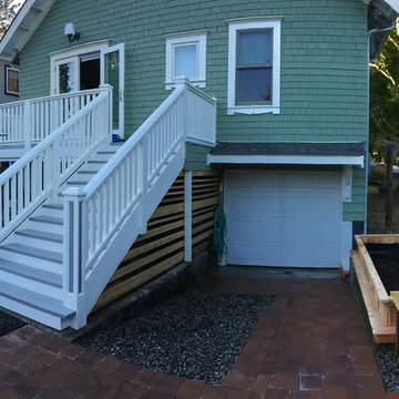 Complete rebuild of stairs, railings, planters, cedar siding,