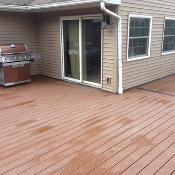Composite deck with hot tub and pool.