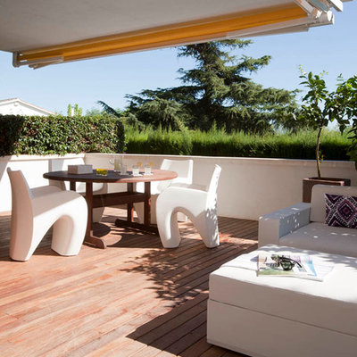 Deck - mid-sized contemporary deck idea in Other with a roof extension