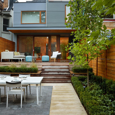 Trendy deck photo in Toronto with a roof extension