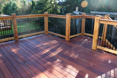 Example of a small trendy backyard deck design in Vancouver with no cover