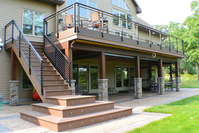 Deck - large modern backyard deck idea in Minneapolis