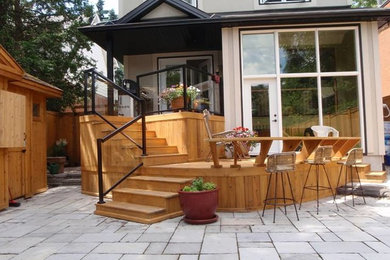 Minimalist backyard deck photo in Ottawa with no cover