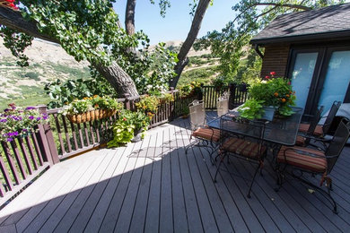 Example of a minimalist backyard deck design in Salt Lake City with no cover