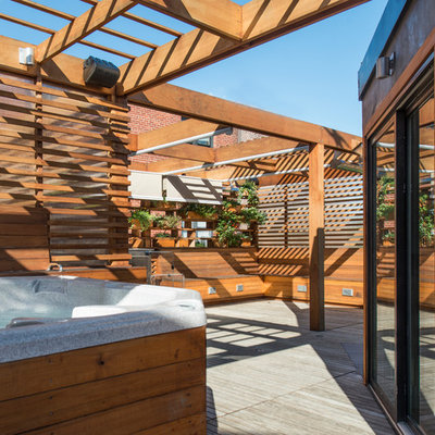 Outdoor kitchen deck - small modern rooftop outdoor kitchen deck idea in DC Metro with a pergola