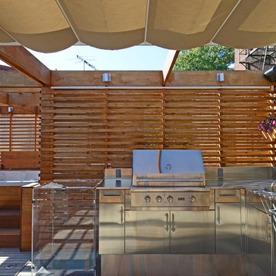 Small minimalist rooftop outdoor kitchen deck photo in DC Metro with a pergola