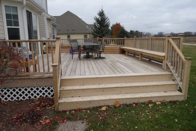 This is an example of a medium sized modern back terrace in Milwaukee with no cover.