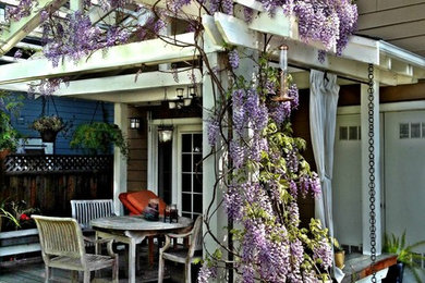 Inspiration for a transitional backyard deck remodel in San Francisco with a pergola