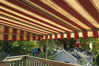 Mid-sized minimalist rooftop deck photo in Baltimore with a roof extension