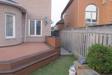 Deck - large backyard deck idea in Toronto