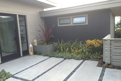 Inspiration for a large modern backyard deck remodel in San Francisco with a roof extension