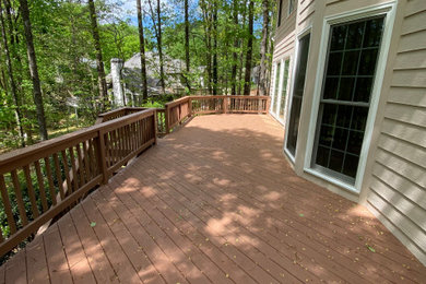 Large arts and crafts backyard deck photo in Atlanta with no cover