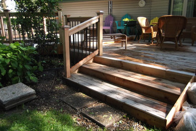 Inspiration for a large contemporary backyard deck remodel in Minneapolis