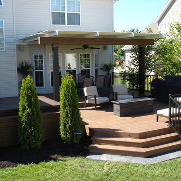 Deck with louvered roof, fire feature, and inset hot tub - Dardenne Prairie, MO