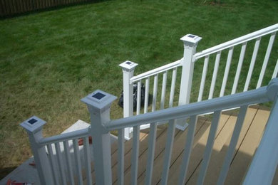 Example of a classic backyard deck design in New York with no cover