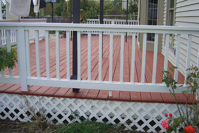 Inspiration for a mid-sized transitional backyard deck remodel in Other with no cover
