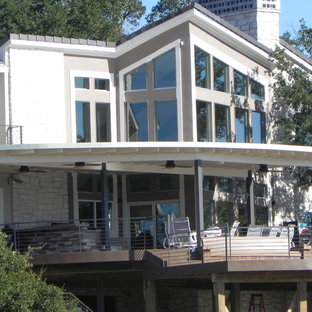 Inspiration for a large contemporary backyard outdoor kitchen deck remodel in Austin with a roof extension