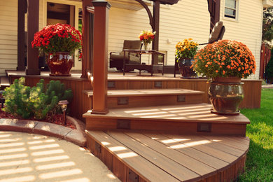 Inspiration for a backyard deck remodel in Other with a pergola