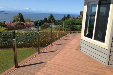 Deck - large backyard deck idea in Vancouver with no cover