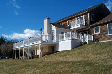 Diseño de terraza clásica grande sin cubierta en patio trasero