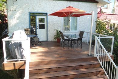 Small elegant backyard deck photo in Calgary with no cover