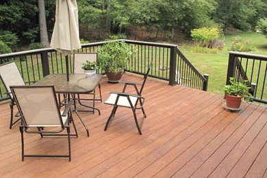 Large backyard deck photo in Boston with no cover