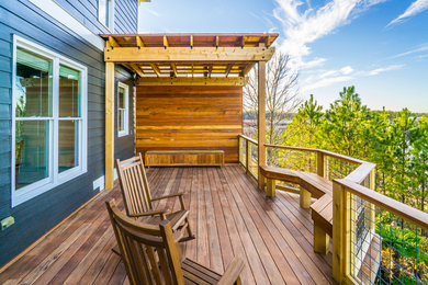 Large trendy backyard deck photo in Atlanta with a pergola