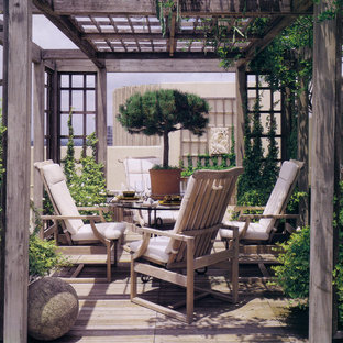 Mountain style deck photo in Atlanta with a pergola